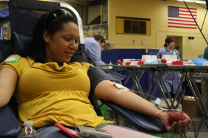 Senior Lauren Dinkins donates blood at the April 12 Red Cross Blood Drive at CMR.