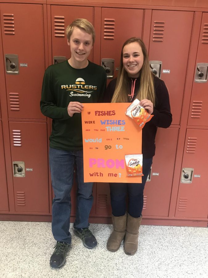 Swimming together for years, Alex Houston gathers his courage and asks fellow swimmer Maddie Carroll to prom. Knowing she loves the iconic Goldfish cracker, he created a sign specific for her. Excitedly, she says of course.