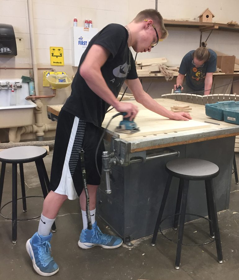 Sophomore Blaise Varty works on his final project in Woods class on May 15.