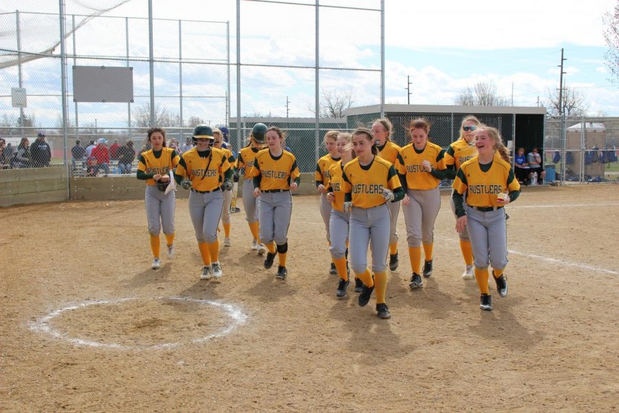 The Lady Rustlers celebrate a home run during a game against Billings Skyview in 2019.