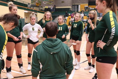 Head coach Patrick Hiller offers encouragement to his team during a timeout Sept. 19. The Rustlers defeated the Gallatin Raptors. 