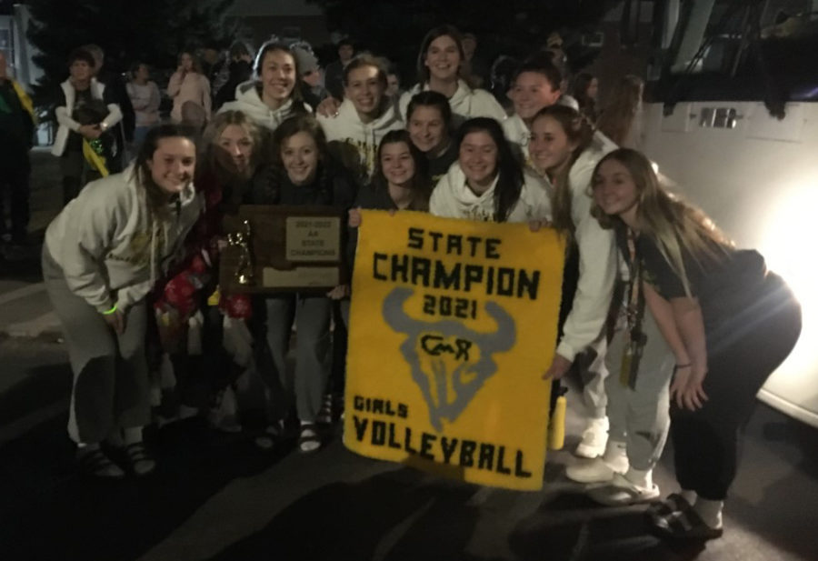 The state champion Rustler volleyball team poses for a shot after arriving back in Great Falls on Nov. 13.