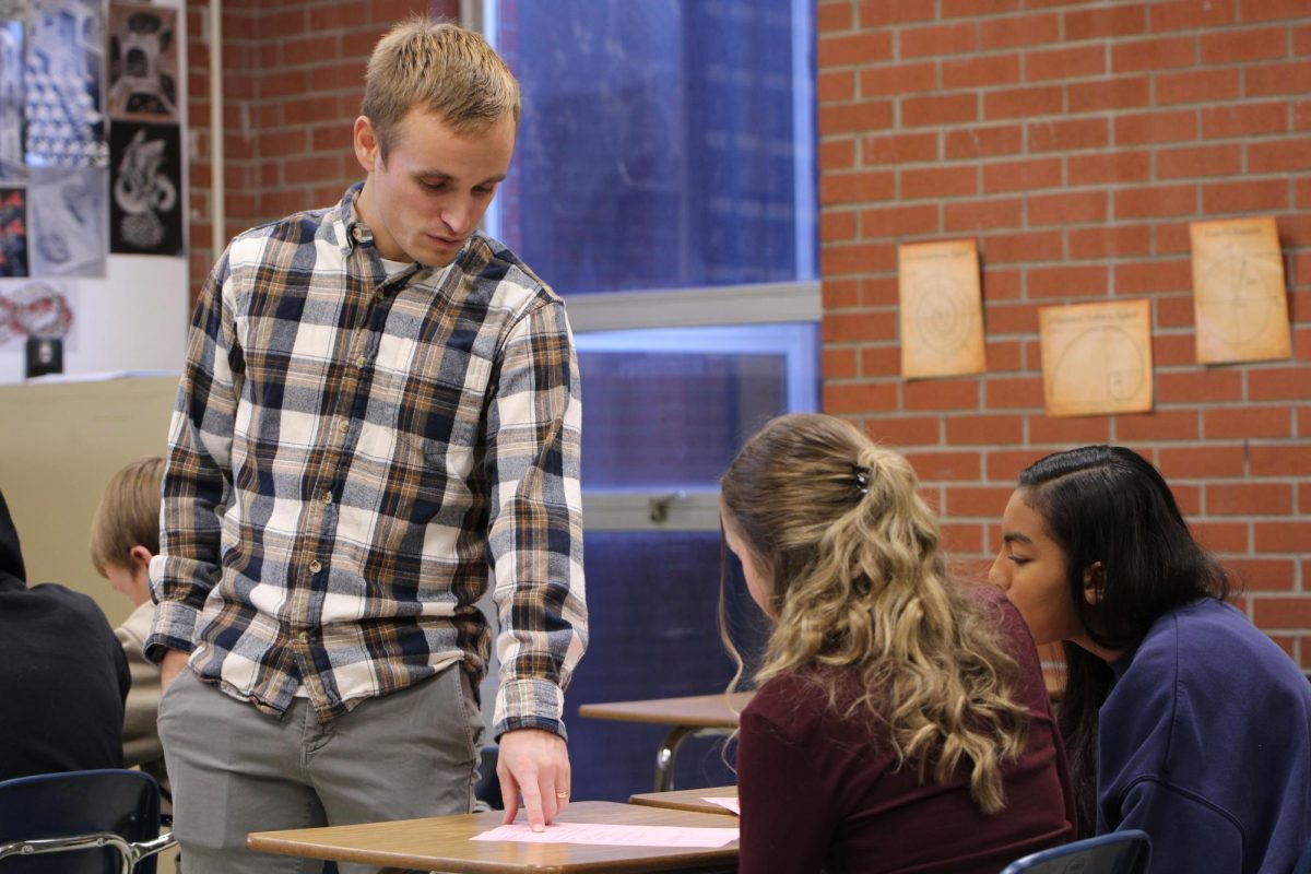 Teacher Jace Duffield assists algebra 1 students in completing assignment on Dec. 4.  