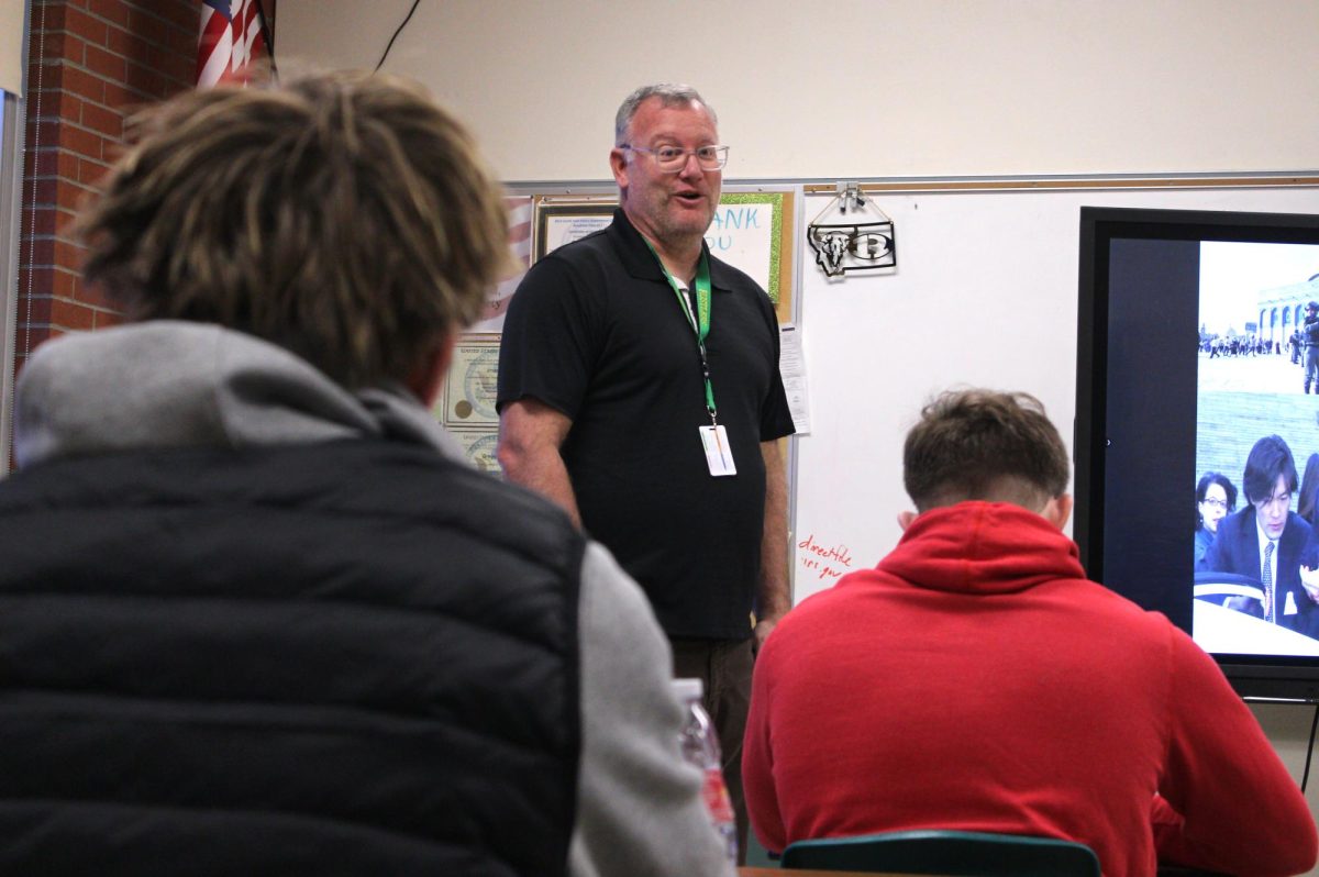 Teacher Gregg Dart discusses U.S. Embassies with his first period class on Jan. 8. His approach to teaching ensures that each student is able to learn at the same pace.