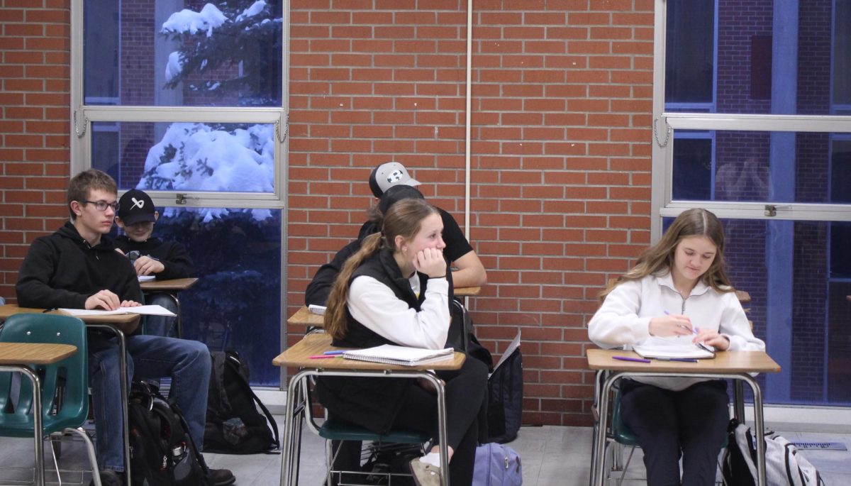 On Jan. 8, students in Dennis Mora’s first period Montana Gov class listen to him talk while getting ready to take notes. 