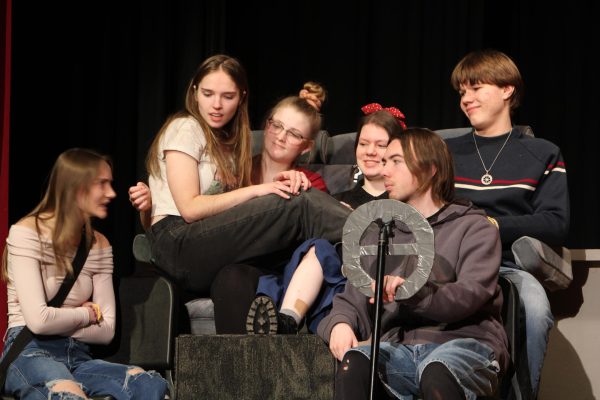 Members of the cast of "Dead Highway" perform for students and staff during period 3 on Feb.7.