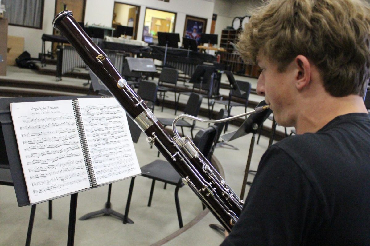 Melodies fill the band room in C.M. Russell High School's Bill Williamson Hall on Feb. 7.  Putting in his extra practice hours, junior Scotlen Brown plays many instruments, but at CMR he specializes in the bassoon and the baritone saxophone.