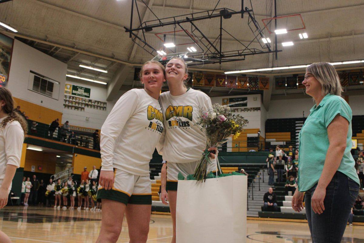 Kayla Deeble, right, celebrates senior night with her teammate Avery Youngblood on Feb. 18.