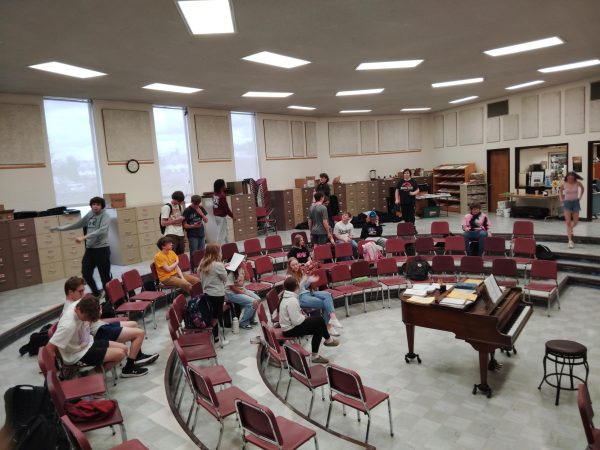 Chanteur choir prepare to enrich themselves with music and song.