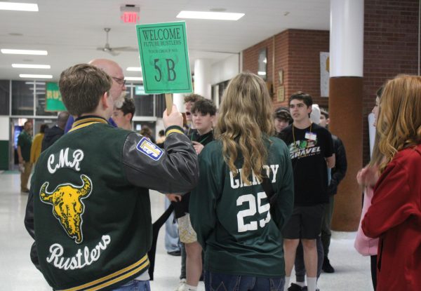 Senior role models Kaydence Gilroy and Jack Orthman guide their group of incoming freshmen throughout the halls of CMR.