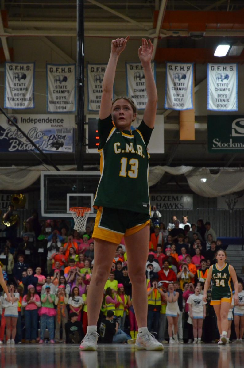In a crosstown moment, senior Kieva Mapes attempts a free-throw with the opposing teams student section trying their best to throw her off at the Rustler-Bison game on Jan. 23.
