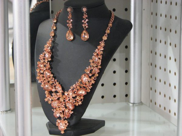 A necklace and earring set is displayed among the many accessories sold by Rebecca Hannant in Great Falls.