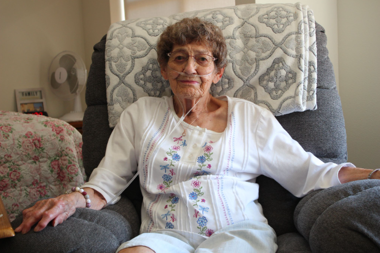 Highgate Senior Resident Roberta Kandilas waits with flowers in preparation of an interview.